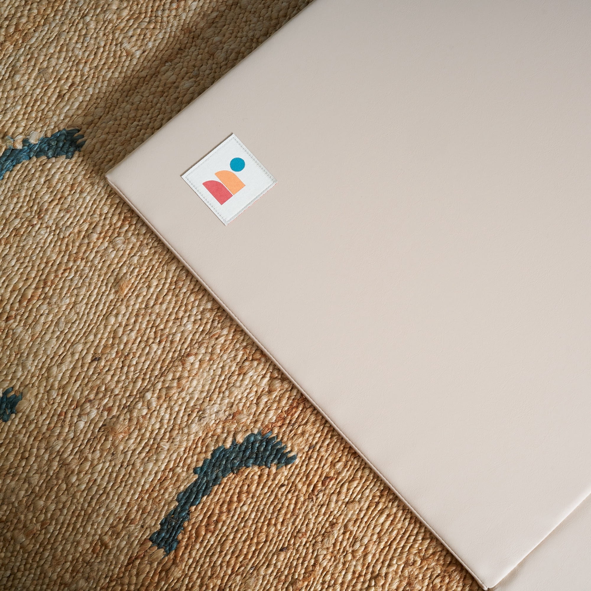 Taupe cushioned non-toxic baby play mat with smooth vegan leather surface