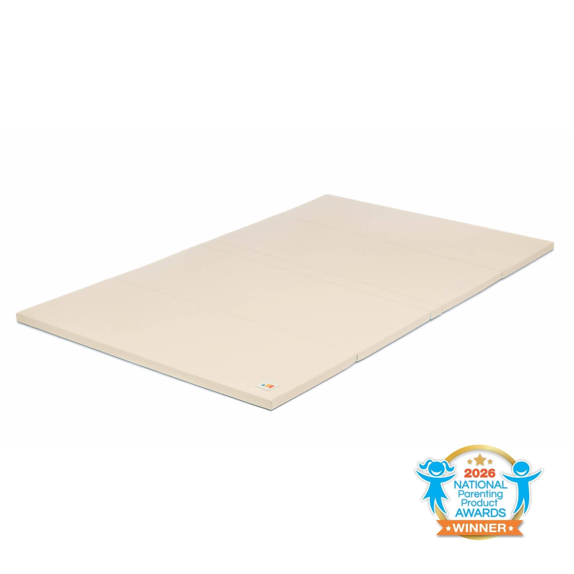 Taupe non-toxic cushioned baby play mat with wipe-clean vegan leather, laid flat on floor with national parenting product award seal